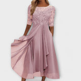 Sara – Elegantne obleke za svate na poroki" can be rewritten as:

"Sara – Elegantne poročne obleke za svate