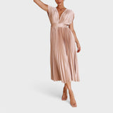 Paula - Elegantna plisirana obleka" can be rewritten as "Paula - Elegant Pleated Dress.